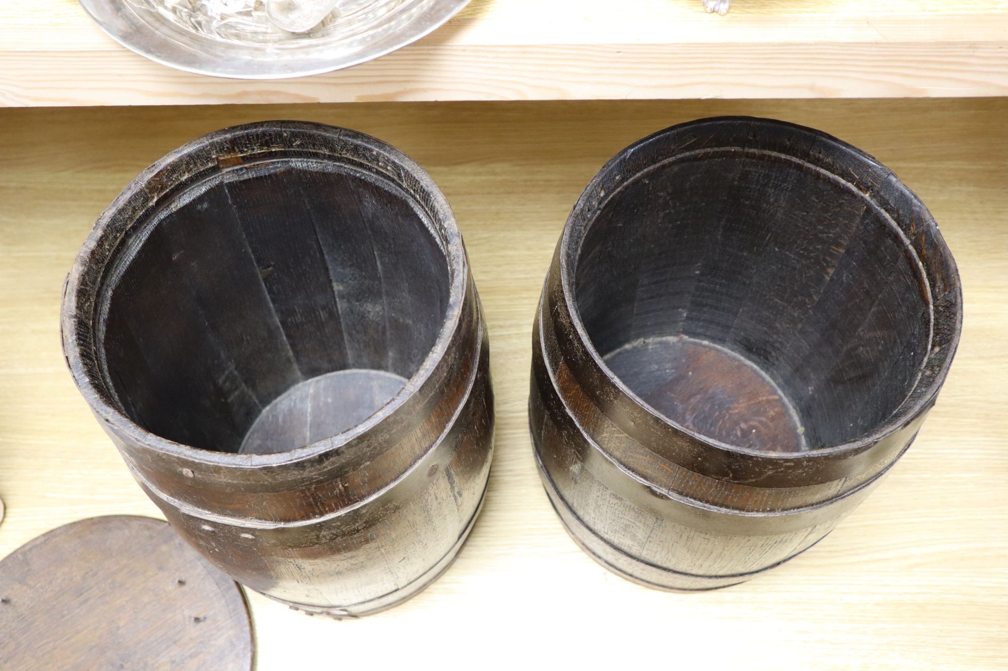 Two coopered oak sherry barrels (converted as small tables), height 39cm
